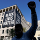 A person reacts on April 20, 2021, in Washington, at Black Lives Matter Plaza near the White House after the verdict in Minneapolis, in the murder trial against former Minneapolis police officer Derek Chauvin was announced. Few Americans believe there has been significant progress over the last 50 years in achieving equal treatment for Black people in dealings with police and the criminal justice system. That’s according to a new poll by The Associated Press-NORC Center for Public Affairs Research.